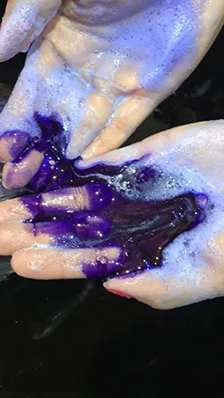 Applying purple shampoo